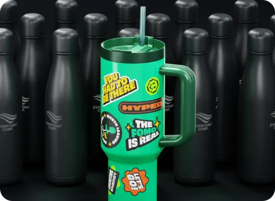A green cup, like what you might get as event swag, covered in stickers