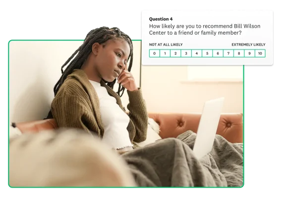 Woman looking at laptop, with floating image of NPS survey in background