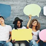 6 adults holding comment boxes.