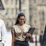 3 professionals walking outside