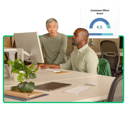 Man working on a laptop adding charts and graphs to a survey analysis report.