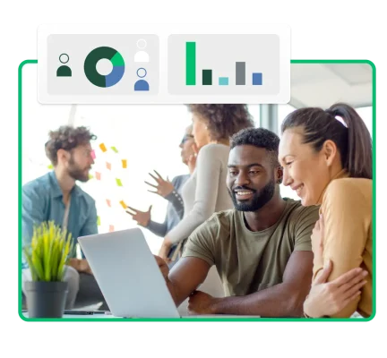 Two people reviewing corporate diversity charts on a laptop