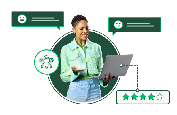 Smiling woman looking and gesturing at a laptop