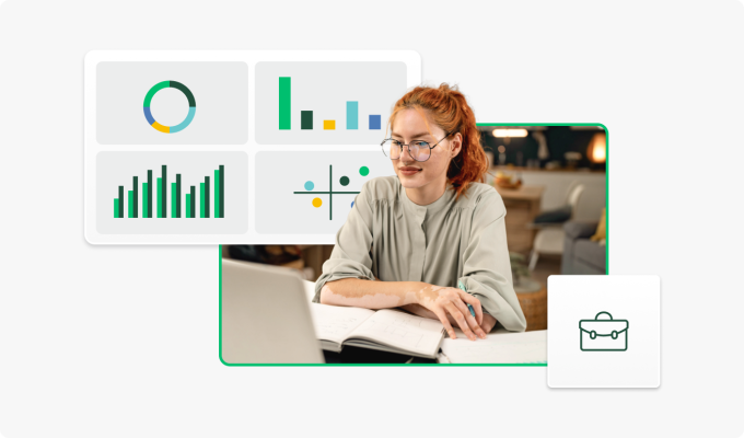 Woman looking at graphs on laptop