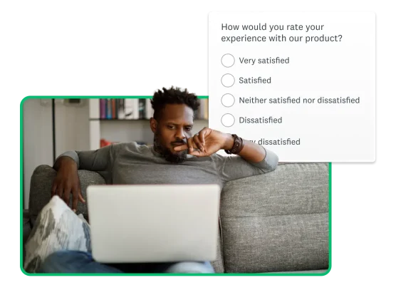 Man sitting on couch using computer with a product screenshot floating around him.