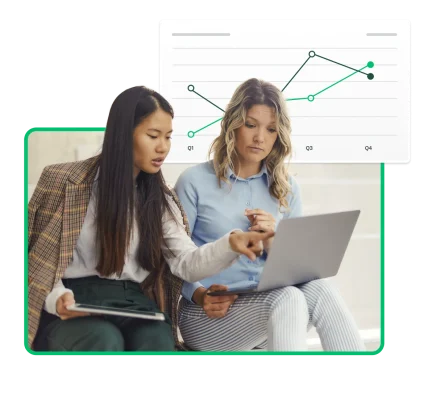 two women looking at graphs