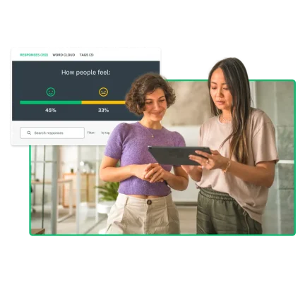 two women looking at tablet with marketing question