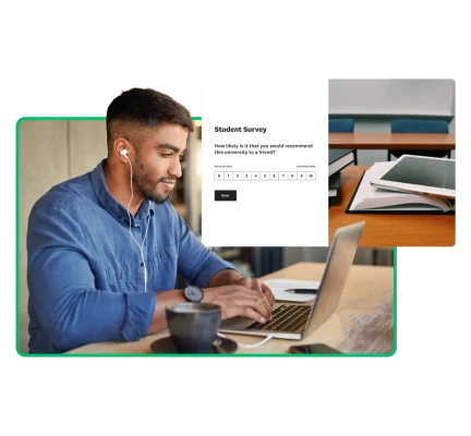 Man with wired headphones sitting at a desk and working on a laptop on a student survey