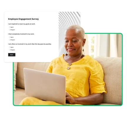 woman in yellow on laptop