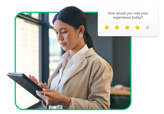 woman looking at tablet, with floating survey question in background: How would you rate your experience?