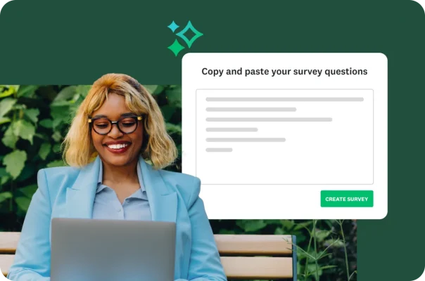 A woman smiling and working on a laptop, with a pop-up showing the copy and paste survey question feature.