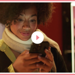 Woman holding and looking at a phone