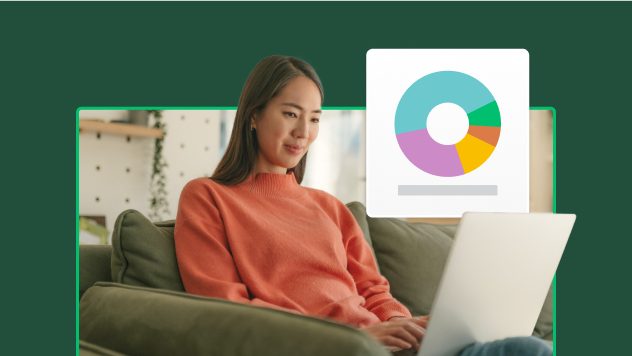 Woman sitting on a couch, working on her computer