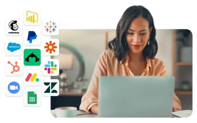 Woman working on laptop, next to various icons of integrations that work with SurveyMonkey, such as Zoom, Slack, MailChimp, and Hubspot