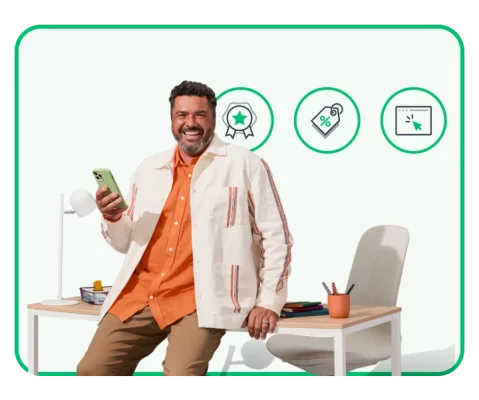 Smiling man holding phone next to icons of awards, price tag, and click button