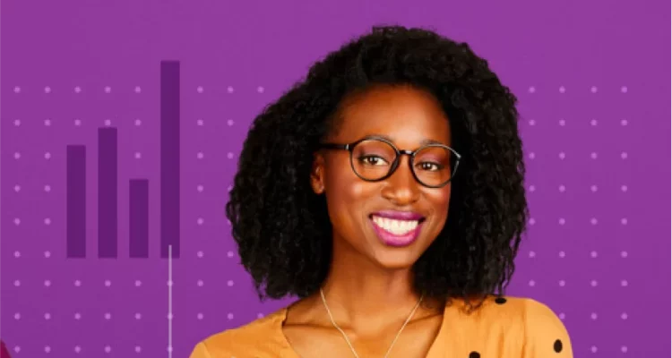 Smiling woman with glasses next to bar graph