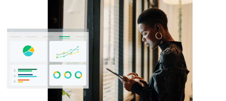 Woman standing at window looking and tapping on her phone, with a screenshot of charts and graphs in the background