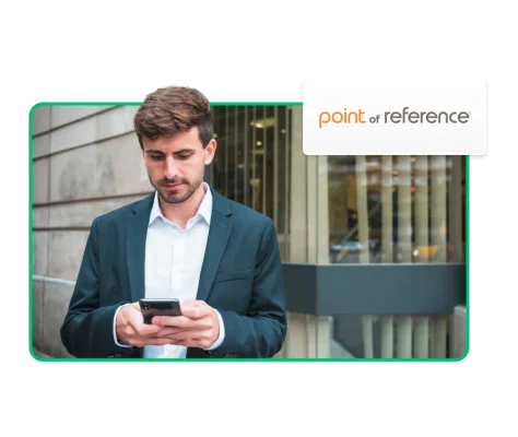 Man in suit looking at his phone, next to Point of Reference logo