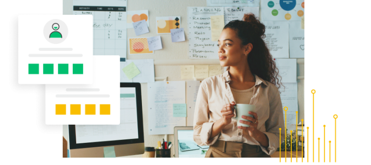 Woman holding mug and standing in front of a wall covered with sticky notes and papers