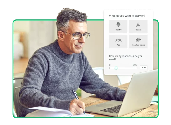Person working on laptop next to screenshot of SurveyMonkey audience panel