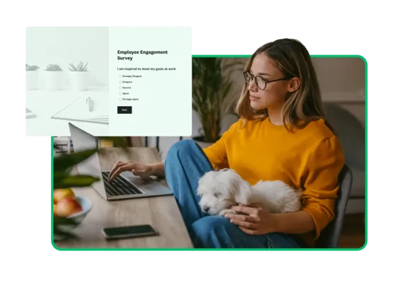 Woman with a dog on her lap are sitting at a desk, looking at a computer, next to a screenshot of an employee engagement survey