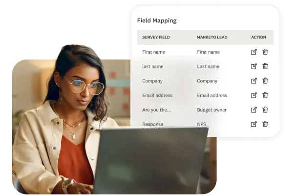 A woman working on the computer with a product screenshot of field mapping.
