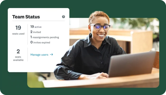 A woman smiling and working on a laptop with an overlay showing a Team Status dashboard with details on seats used, seats available, active, invited, and reassignments pending.