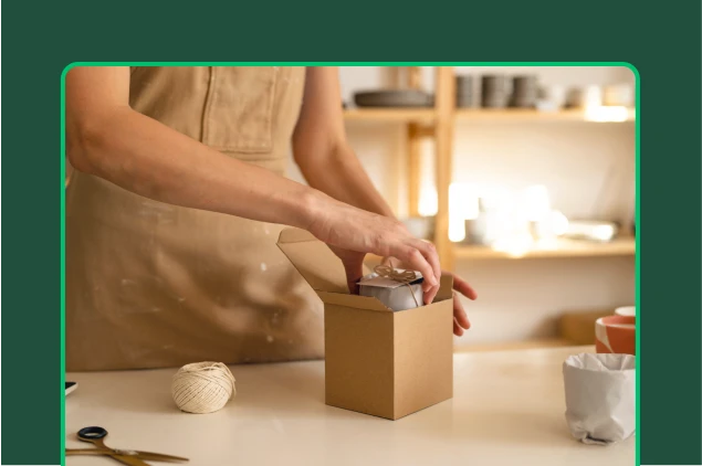 Person boxing a package for delivery