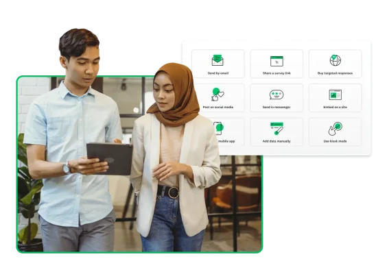 Two people looking at tablet computer, with survey icons floating in background