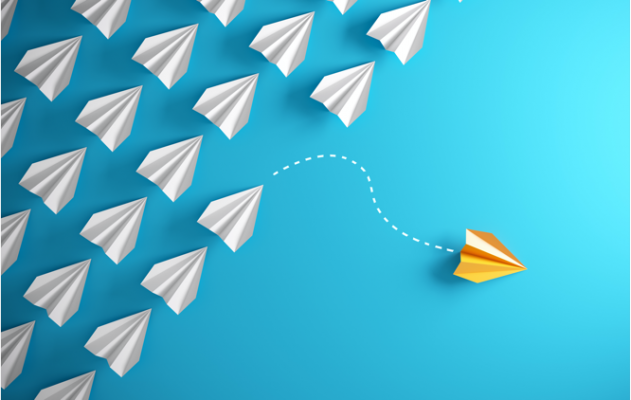 Paper airplanes with one that is yellow