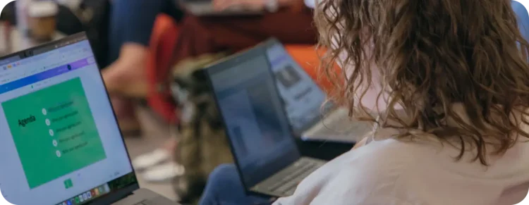 Person looking at a laptop screen with an agenda