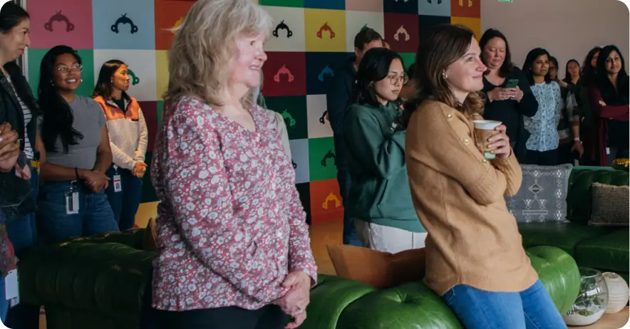 SurveyMonkey employees gathered and watching something