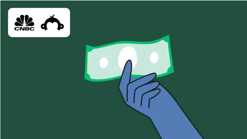 Hand holding a dollar bill