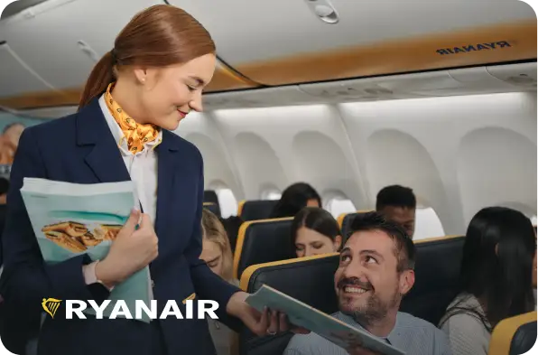 Flight attendant talking to a man with Ryanair logo