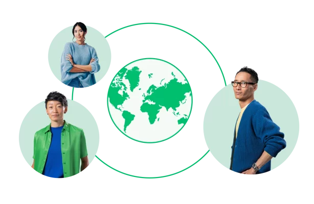 three people surrounding a globe