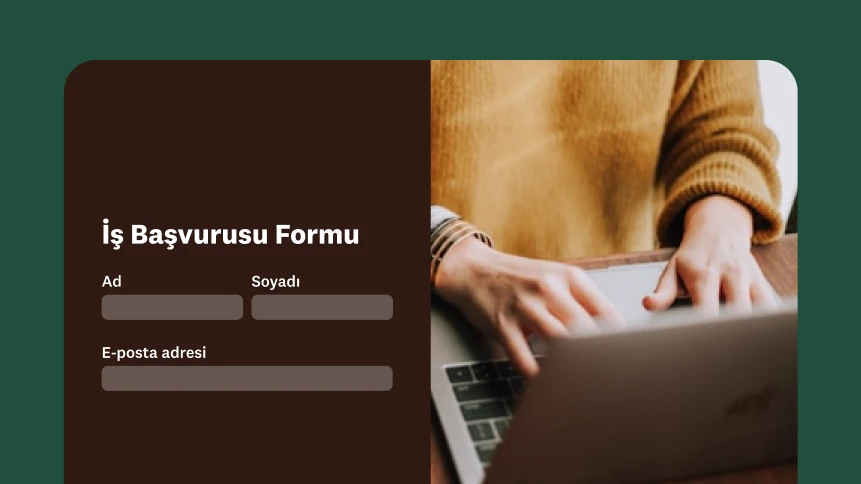 Dizüstü bilgisayarda yazı yazan bir kişi ve yanında bir iş başvurusu formu.