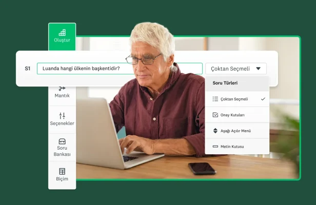Dizüstü bilgisayarına bakarak anket oluşturan bir adam.