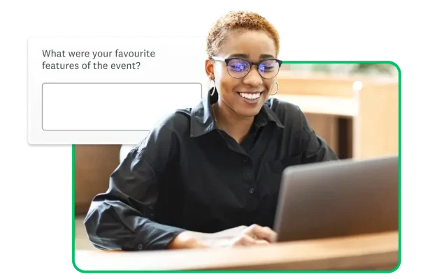 Woman with glasses smiling at laptop, next to a text box survey question asking “What were your favourite features of the event?”