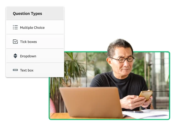 A man sitting at an open laptop and looking at a phone screen next to a screenshot of SurveyMonkey question types
