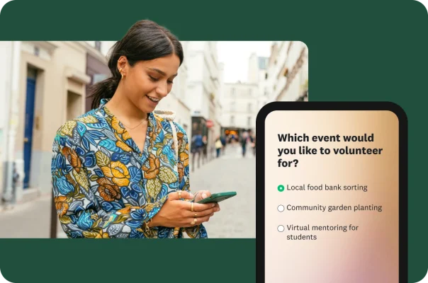 A person walking down the street and looking at a mobile survey for volunteer sign-ups