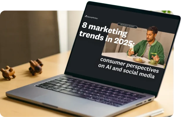A laptop with its screen showing the title “8 marketing trends in 2025: consumer perspectives on AI and social media”