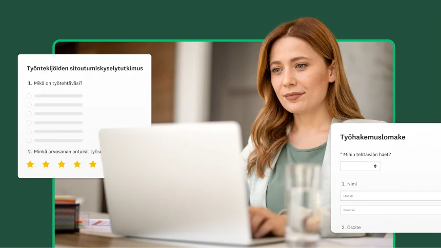 Nainen työskentelee tietokoneella, ja hänen vieressään on työntekijöiden sitoutumiskyselytutkimus