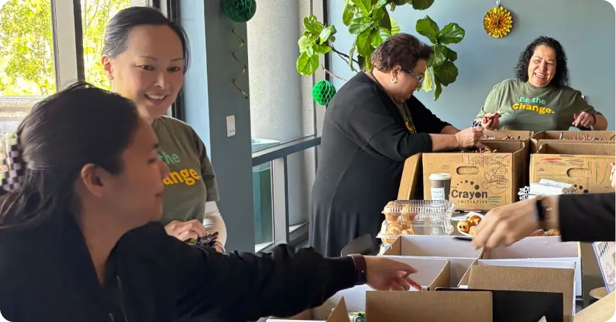 SurveyMonkey employees packing donation boxes