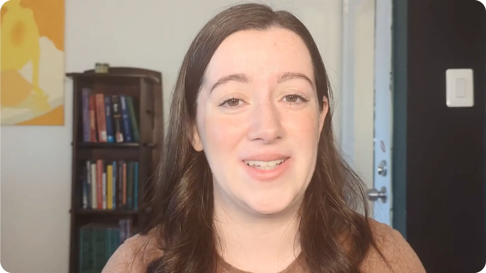 Instructor speaking directly to the camera during a SurveyMonkey Survey Basics lesson.