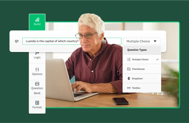 A man looking at this laptop creating a survey.