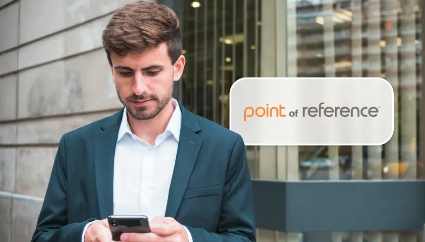 Man in business suit looking on his phone, next to Point of Reference logo
