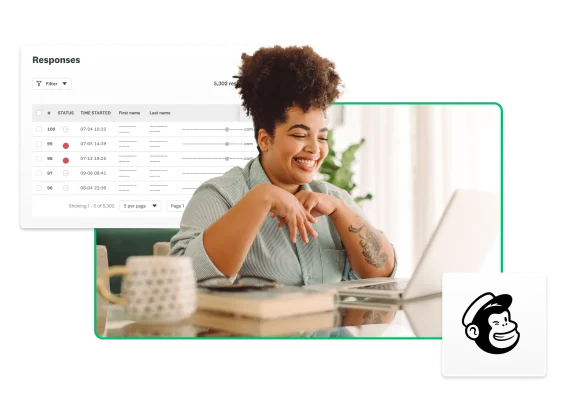 Woman sitting at a desk looking at her laptop with the mailchimp logo and product screenshots floating around her