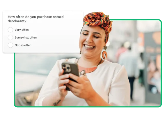 Woman looking at cell phone, with floating image of survey asking "how often do you purchase natural deodorant?"