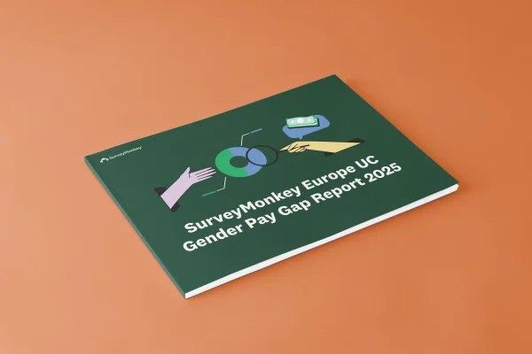 A mock-up of the SurveyMonkey Europe UC Gender Pay Gap Report 2025 document cover, featuring an illustration of a pie chart, money, and hands.