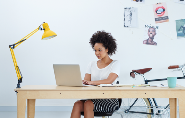 Woman typing at desk